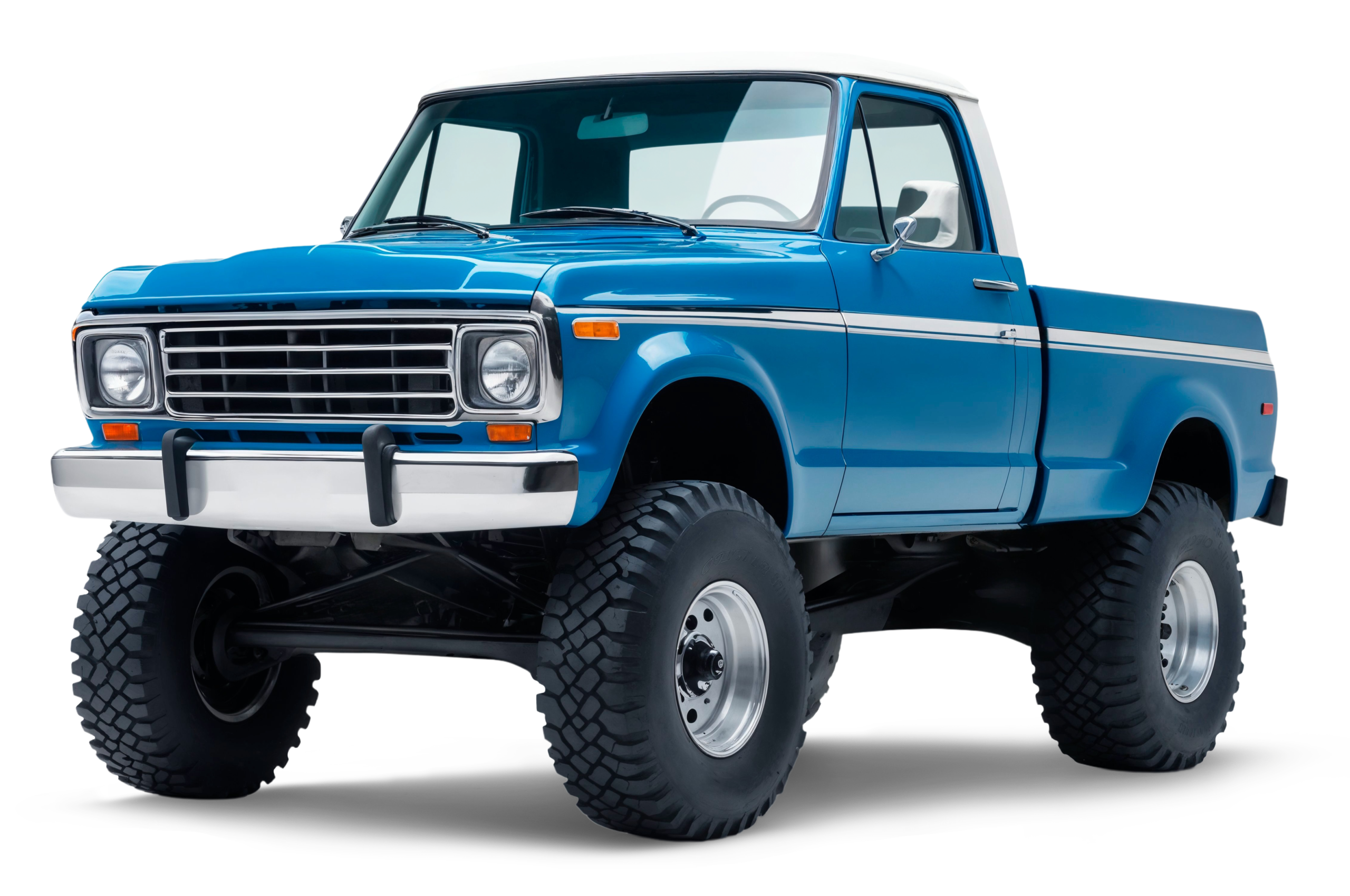 Classic blue lifted pickup truck with off-road tires.
